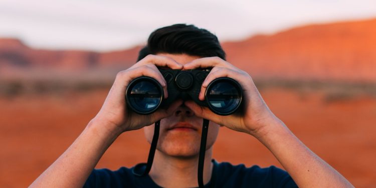 Man using binoculars.